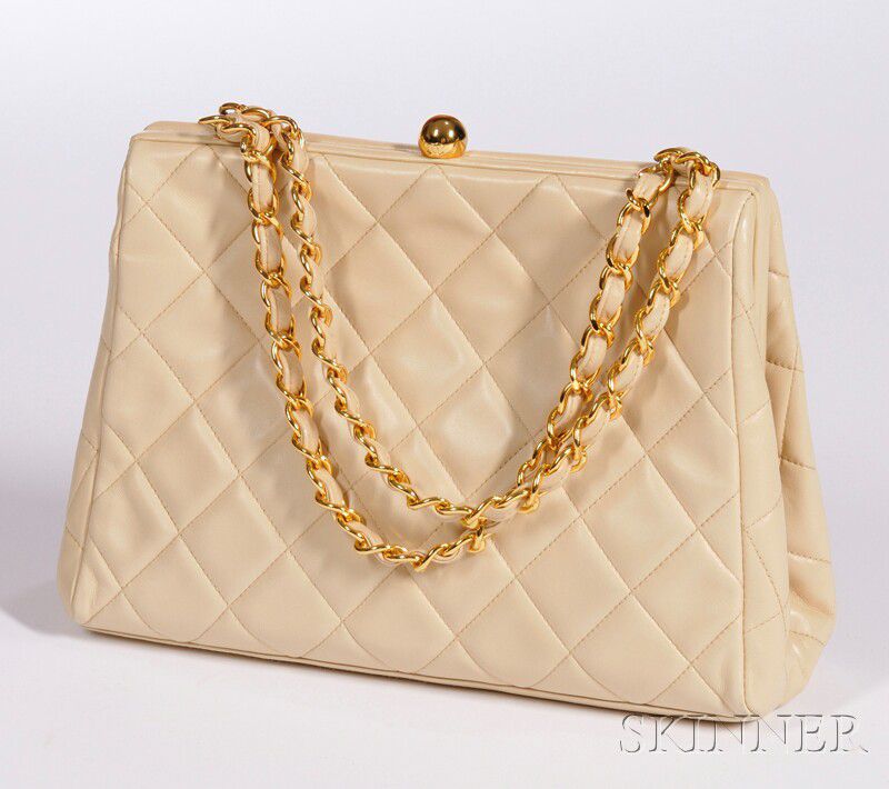 Sold at auction Chanel Cream-colored Quilted Purse Auction Number