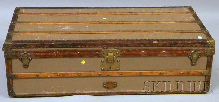 Sold at Auction: A travel trunk by Louis Vuitton, first half 20th century.