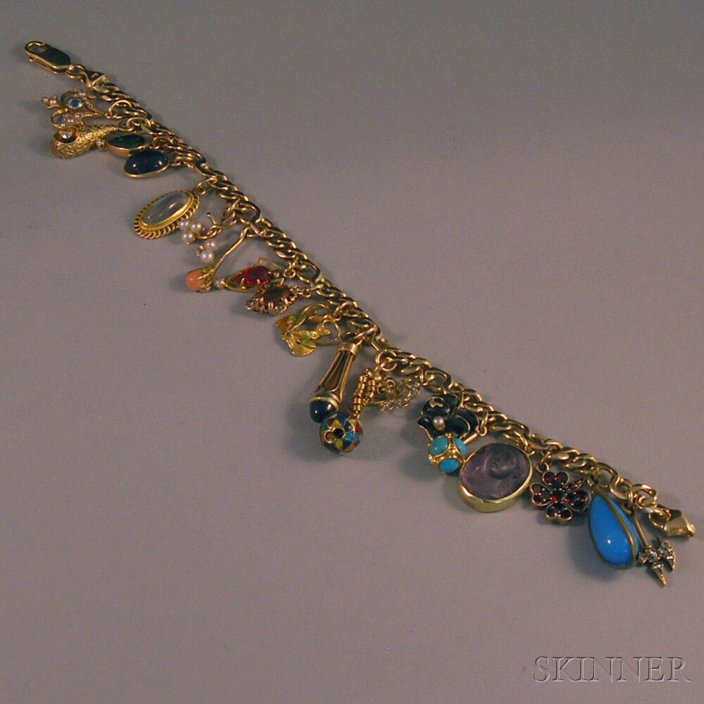 14kt Gold Charm Bracelet | Sale Number 2694M, Lot Number 555 | Skinner Auctioneers