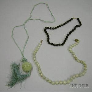 Strand of Jade Beads, Carved Jade Ball Pendant, and a Black Jet Beaded Necklace.
