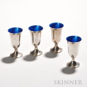 Four Towle Sterling Silver and Enamel Cordial Glasses, mid to late 20th century, each with a blue-enameled interior, ht. 3 1/8 in.