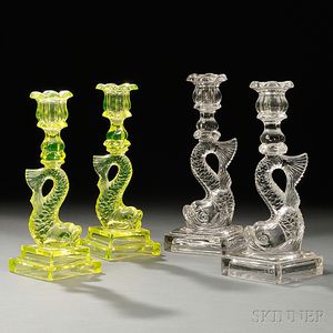 Two Pairs of Pressed Glass Dolphin Candlesticks