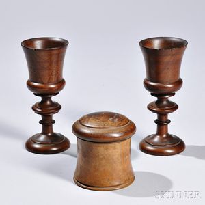 Three Turned Wood Objects, 19th century, including a pair of mahogany goblets and a hardwood string holder, ht. 3 1/2 to 6 1/2 in.