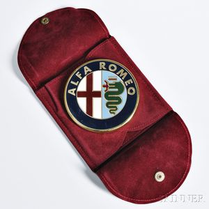 Alfa Romeo Paperweight, 20th century, the brass and enamel crest with felt bottom and custom burgundy pocket with snap enclosure, dia.
