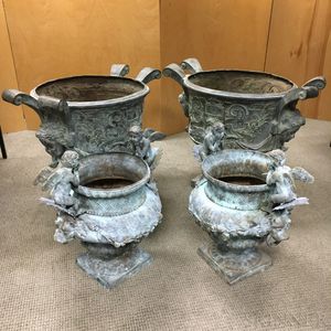 Two Pairs of Patinated Metal Figural Garden Urns