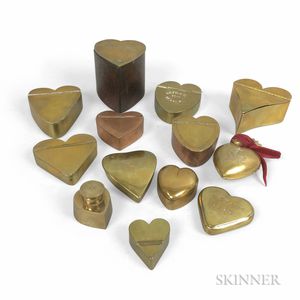 Thirteen Small Brass Heart-form Boxes