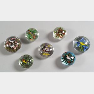 Seven Rick Ayotte Glass Paperweights