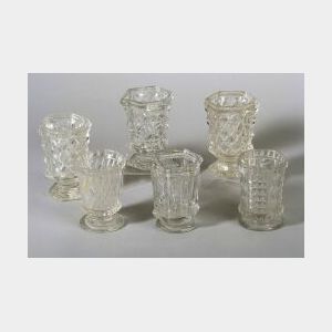 Six Colorless Pressed Glass Spoon Holders