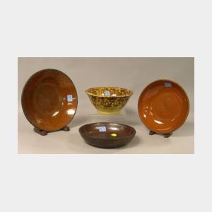 Three Redware Bowls and a Rockingham Glazed Yellowware Bowl.