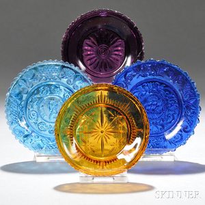 Four Assorted Colored Pressed Lacy Glass Cup Plates