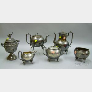 Five-piece Victorian Egyptian Revival Silver Plate Tea Set and a Silver Plated Covered Sugar Urn.