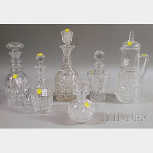 Five Colorless Cut Glass Decanters and a Pitcher with Cover.