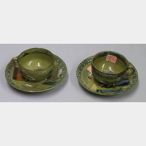 Two Buffalo Pottery Emerald Deldare Ware "Dr. Syntax and Bookseller" Saucers and a Pair of Deldare Ware Cups