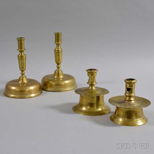Four Early Continental Brass Candlesticks