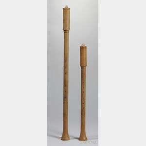 Two Capped Double Reed Wind Instruments