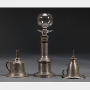 Two Pewter Hand Lamps and a Make-do Glass and Pewter Lamp