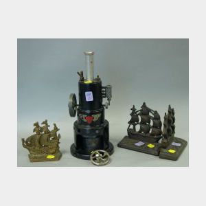 Pair of Cast Iron Old Ironsides Bookends, a Brass Sailing Ship Bookend and a Marv Painted Metal Robert Fulton Line Steam Engine Mod
