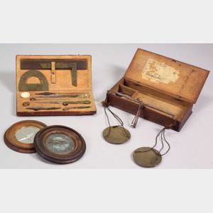 Three Cased Items, a Scale, a Drafting Kit, and a Mirror