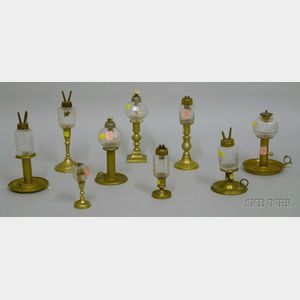 Nine Colorless Glass Peg Lamps on Brass Candlestick Bases
