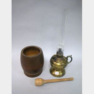 Wooden Mortar and Pestle with a Brass Hand Lamp.