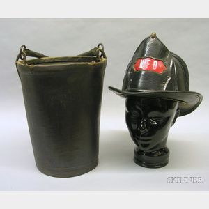 Cairns & Co. Black Leather Fire Helmet and a Fire Bucket