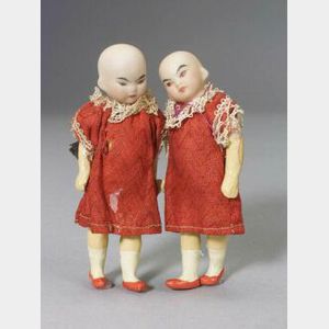 Pair of Small Oriental Bisque Head Dolls