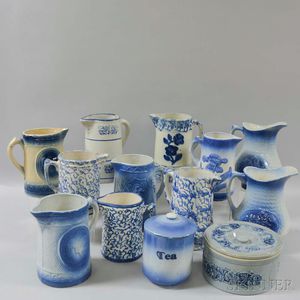 Eleven Blue and White Stoneware Jugs and Two Covered Jars