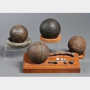 Four Excavated Iron Cannonballs
