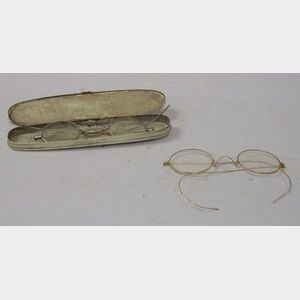 14kt Gold Spectacles, an 1864 Case, and a Pair of Spectacles.