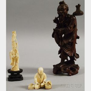 Two Japanese Carved Ivory Okimono and a Carved Wood Figure of an Elderly Peasant.