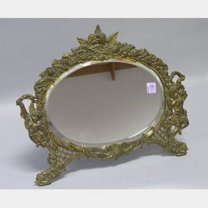 Oval Victorian Cast Brass Angels Decorated Table Mirror with Beveled Glass.