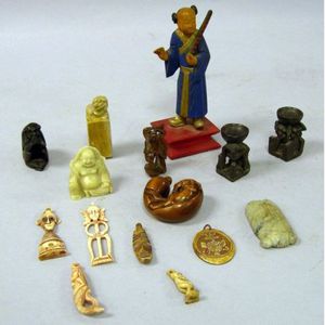 Fifteen Assorted Small Asian and African Carvings