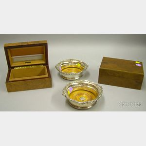 Two Dunhill Cigar Humidors and Two Silver Plated Wine Coasters.