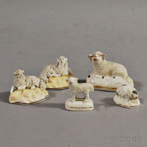 Four Porcelain Lambs and a Bunny Figurine Group
