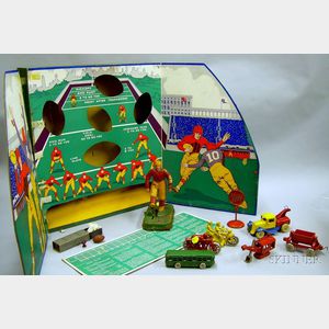 Seven Painted Cast Metal Vehicle Toys and Accessories and a Woolsey's Football Game
