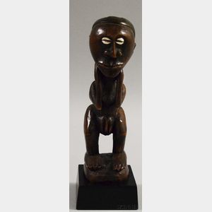 Nsapo-style Carved Wood Standing Female Figure. 