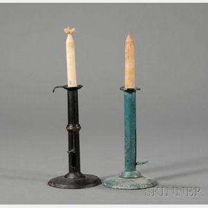 Two Iron Hogscraper-form Candlesticks
