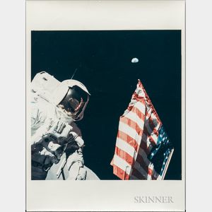 Apollo 17, Harrison Schmitt with the Earth above the American Flag, December 1972.