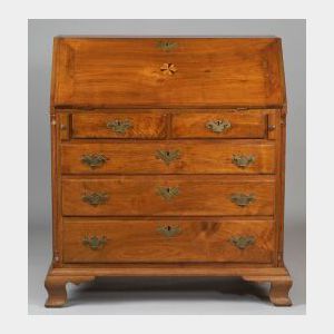 Chippendale Walnut Slant-lid Desk, Pennsylvania, c. 1780, the lid opens to a baise lined interior and central prospect door with molded