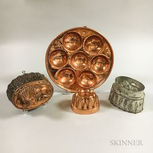 Tin and Three Copper Food Molds. 