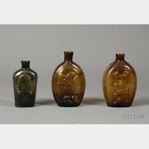 Three Historical Colored Glass Whiskey Flasks