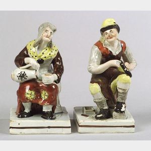 Pair of Staffordshire Pottery Cobbler Figures