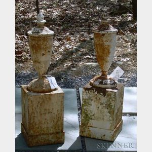 Pair of White Painted Cast Iron Urns on Pedestals