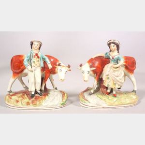 Pair of Staffordshire Pottery Cow Figures with Milkmaid and Farm Hand