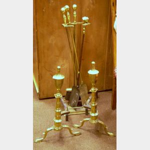 Pair of Brass Urn-top Andirons and Four Brass Fireplace Tools with a Stand.