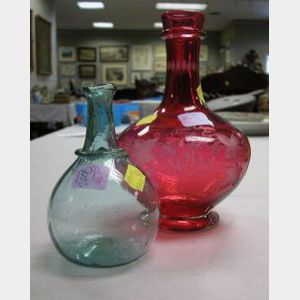 Pale Aqua Blown Glass Chestnut Bottle and an Etched Ruby Glass Presentation Vase.