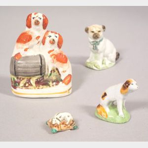 Four Small Staffordshire Pottery Dog Figures
