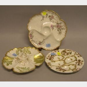 Three Limoges Gilt and Transfer Decorated Porcelain Oyster Plates.
