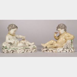 Pair of Pearlware Figures of Seated Putti