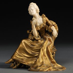 Continental School, Early 20th Century Bronze and Ivory Figure of a Seated Woman with a Rose